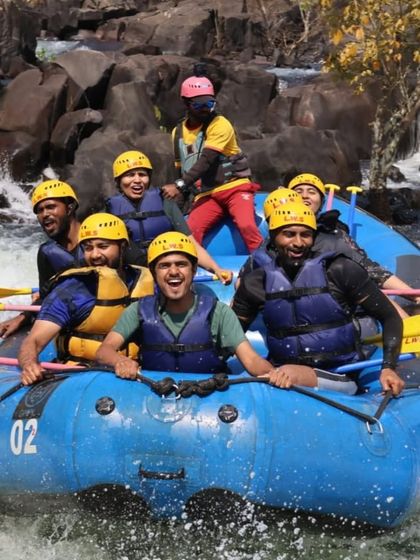 All smiles in the raft. White water rafting is an experience filled with adrenaline and laughter.