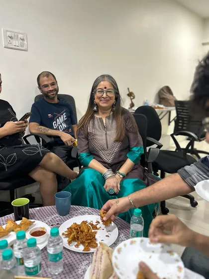 The wonderful Rekha Bhardwaj smiling while enjoying our snacks. It brings me so much joy to see my clients happy and satisfied.