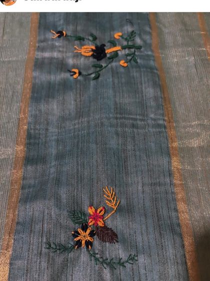 A closer view of the floral butis on the custom saree. Each small bouquet is stitched with care, combining different colors and stitches for a natural, artistic effect.