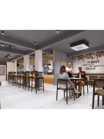 An overall view of the cafe's seating plan, showing a mix of table sizes and seating styles to accommodate various guests.
