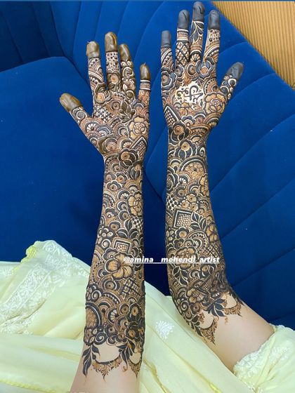 A beautiful and dense bridal design, filled with florals, paisleys, and intricate line work.