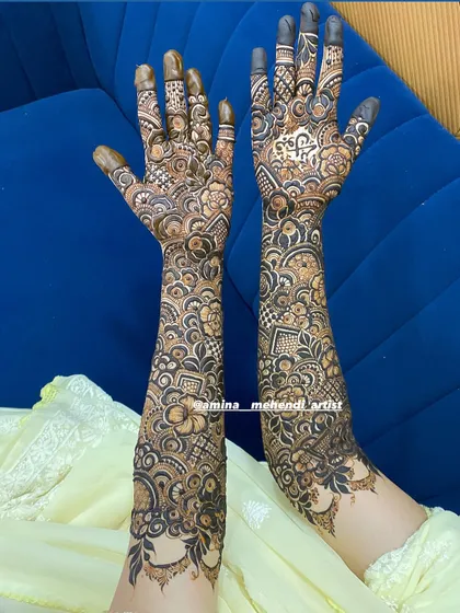 A beautiful and dense bridal design, filled with florals, paisleys, and intricate line work.