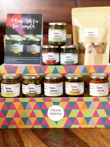 We have a little something for everyone. This display shows some of our most loved pickles, jams, and mathri, all ready for you to take home. We believe in variety and authentic Punjabi taste.