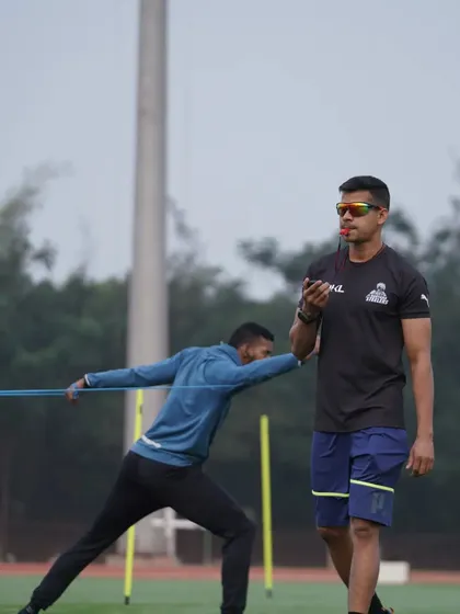 A close watch on a lateral movement drill with band resistance. This exercise specifically targets the muscles responsible for side-to-side quickness and stability.