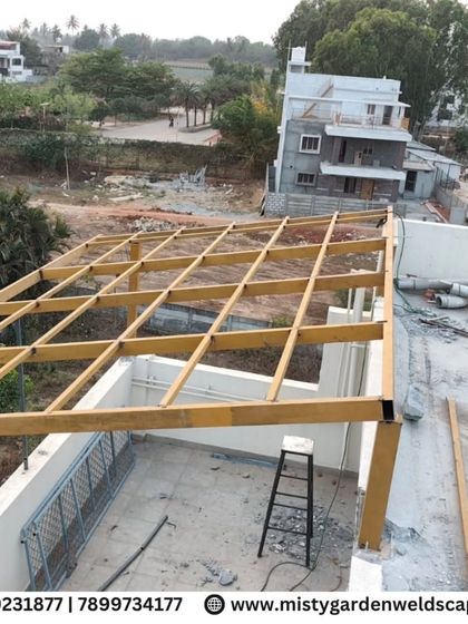 An overhead view of a pergola frame under construction. The grid pattern is essential for distributing the weight of the roof evenly and ensuring structural stability.