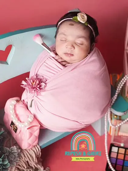 A "little fashionista" themed shoot for a 1-month-old baby, created at home. We bring all the fun, tiny props with us.