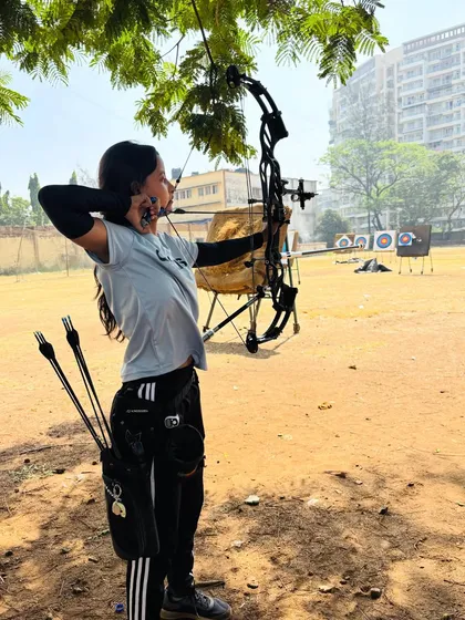 A student takes aim during one of our summer sessions. You can see her focus as she practices with a compound bow, applying the core principles of stance and release that we teach all our beginners.