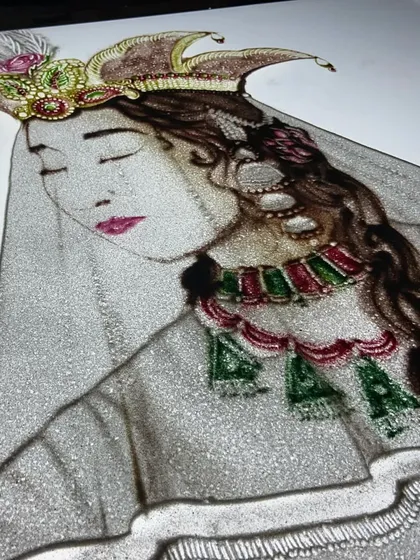 My art goes beyond traditional sand tones. Here, I've reimagined the timeless epic of Mughal-e-Azam, using vibrant colored sand to capture the passion and tragedy of Salim and Anarkali. This piece demonstrates my ability to create detailed, multi-hued portraits and scenes for culturally rich and artistic projects.