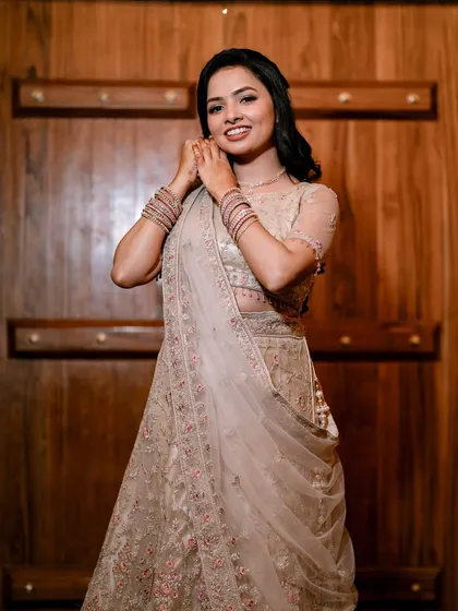 Adjusting her earrings before the event. I love these little moments that show the bride's excitement. Her makeup is soft and pretty, perfect for an engagement.
