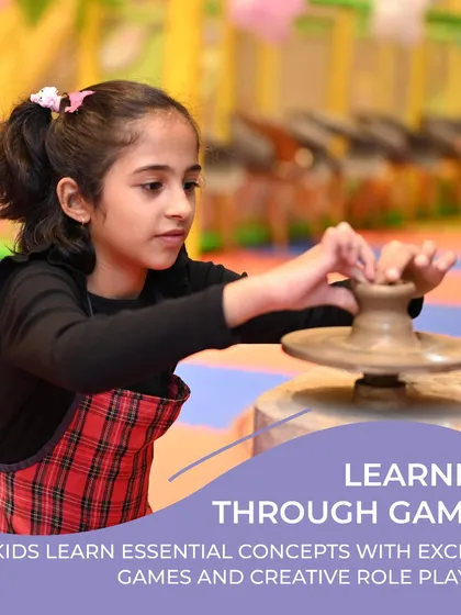 Learning through games is a core part of the Playhouse experience. Here, a young girl gets hands-on with a pottery wheel, learning a new skill while having fun.
