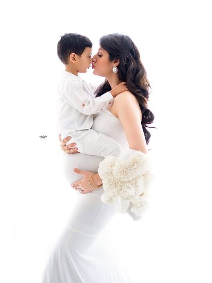 A sweet kiss between mother and son. These are the moments that you will treasure forever.