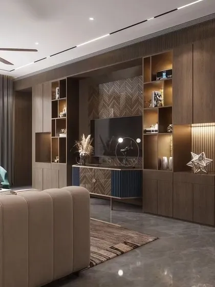 Functionality meets luxury in this family room's entertainment and display unit. We designed this full-wall custom cabinetry with integrated lighting to beautifully showcase art pieces and awards, while neatly housing the media center.