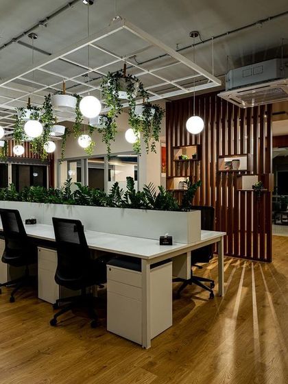 To bring a touch of nature indoors, I integrated lighting with biophilic design elements. The hanging globe lights are interspersed with greenery, providing soft ambient light that creates a refreshing and calm atmosphere in this collaborative work zone.