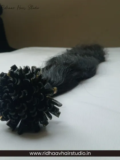 A bundle of our U-Tip wavy extensions laid out, showing the soft, natural waves and quality craftsmanship.