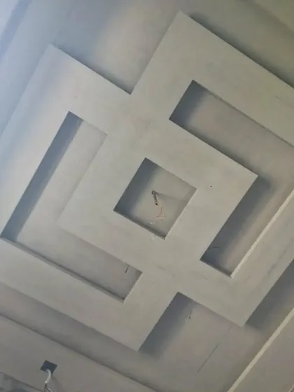 A look at the construction of a geometric tray ceiling. This popular design adds depth and provides a perfect channel for installing hidden cove lighting around the perimeter.