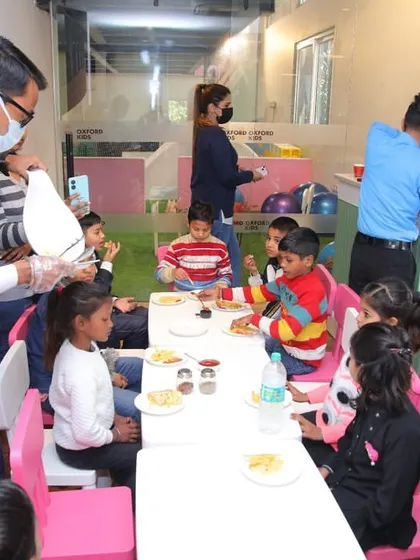 Our staff serving food and cake during a special party organized for unprivileged kids. Seeing their happy faces is our greatest reward.