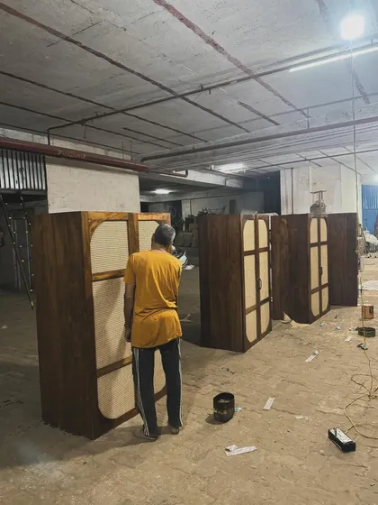 My artisan applying the finishing touches to a series of custom cabinets in the workshop.