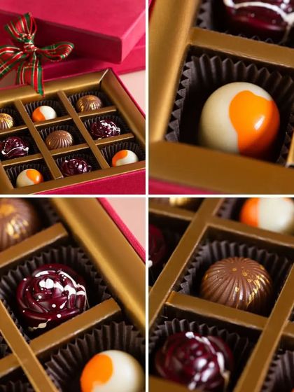 A close-up of my holiday chocolate bonbons. Each one is a small work of art, with unique flavors and stunning designs that make them the perfect festive indulgence.