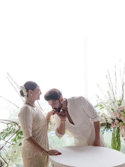 A tender moment as Zaheer kisses Sonakshi's hand after they signed their marriage papers. It’s a classic, romantic gesture that speaks of love and respect.