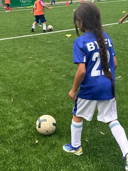 We believe in nurturing passion from the very first touch of the ball. Here, one of our young players is focused and engaged during a drill, showcasing the fun and inclusive environment we create for all kids, including our girls football training program.