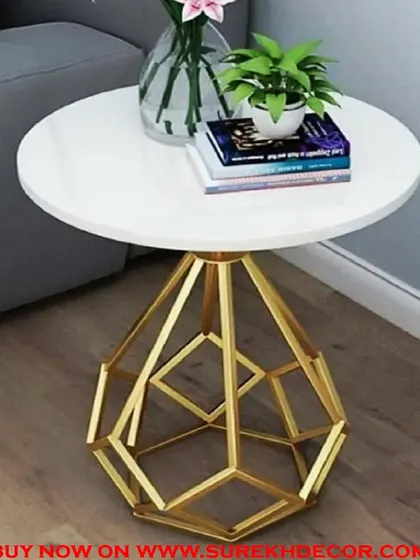 This side table features a white marble top and a unique, diamond-shaped geometric base with a gold electroplated finish. It's a true statement piece that combines artistic design with practical function.