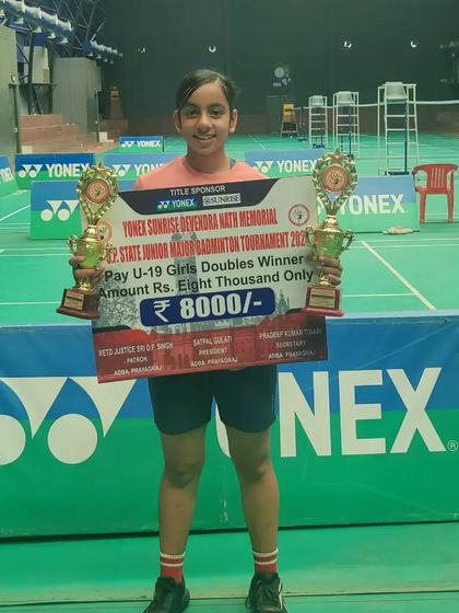 **U-19 Girls' Doubles Gold Medalist.** Ridhima Singh proudly holds her two trophies from the Yonex Sunrise 2nd U.P. Major U-19 Badminton Tournament.