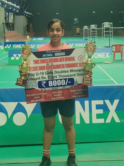 **U-19 Girls' Doubles Gold Medalist.** Ridhima Singh proudly holds her two trophies from the Yonex Sunrise 2nd U.P. Major U-19 Badminton Tournament.