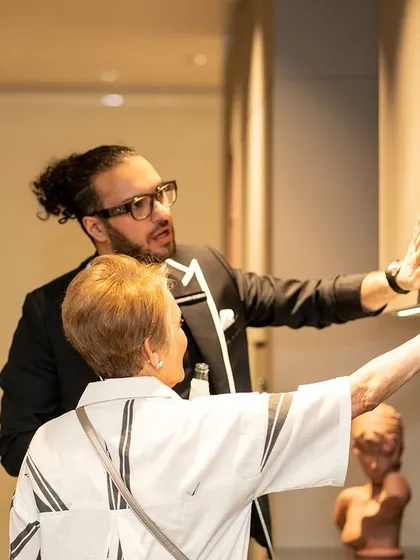 A moment of interaction at our anniversary event, showcasing the hands-on experience we offer in our showrooms.