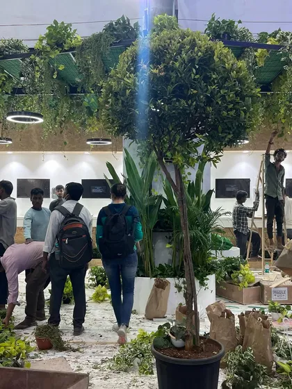 Our team works together to bring the full vision to life. This shot captures the energy and scale of our on-site work, turning an empty space into a temporary indoor garden.
