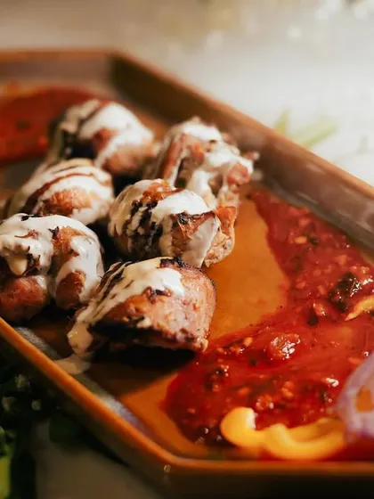Another perspective on the Chicken Mullayam Kebab, highlighting the artistic plating. I believe that a memorable meal starts with a stunning presentation.