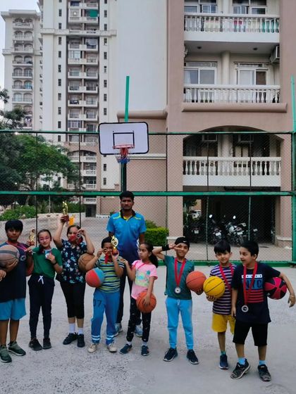 The whole squad celebrating with their medals and trophies after a Ranking Day. It's a day of learning, competition, and fun for everyone involved.