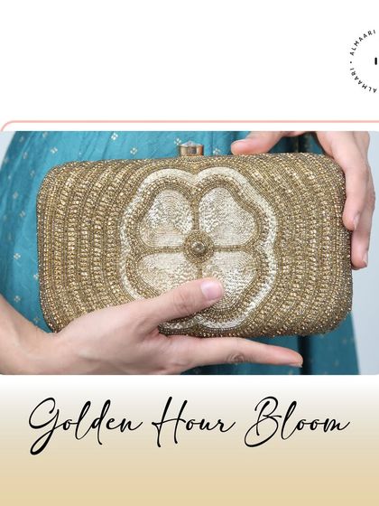Intricate and elegant. This 'Golden Hour Bloom' clutch features beautiful gold beadwork in a floral pattern. It's a timeless piece that pairs wonderfully with traditional Indian wear.
