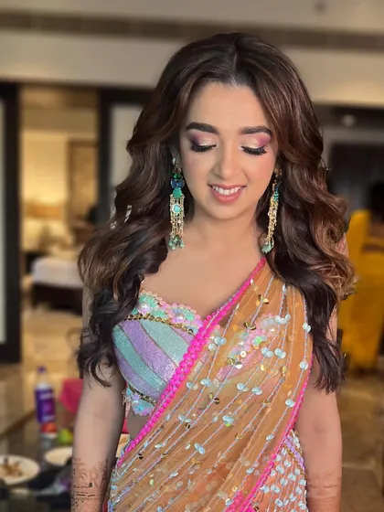 The full Mehendi look, showcasing the stunning sequined saree and the soft, glamorous makeup.