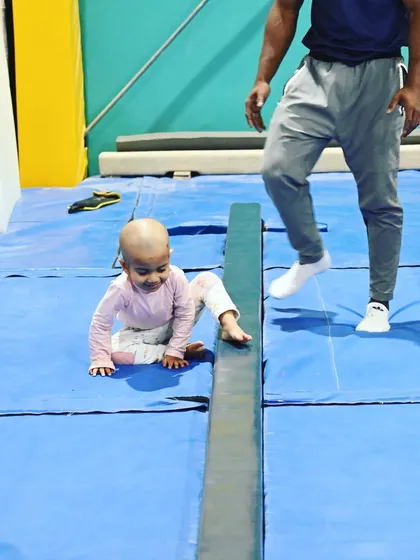 No fear here. This student is learning to navigate the beam, an essential piece of equipment in artistic gymnastics.