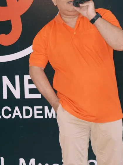 An instructor leading by example, demonstrating vocal techniques to the students during a class.
