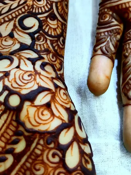 A close-up on the intricate rose and leaf work, showing the shading that gives them a realistic feel.