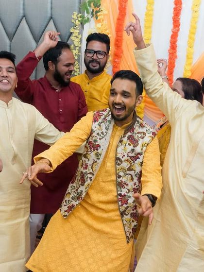 The groom and his friends owning the dance floor during the Sangeet ceremony. We capture the energy and excitement of the performances.