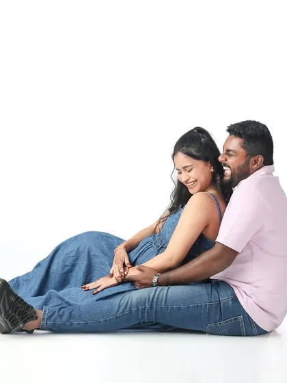 Laughter and love. This candid shot on a clean white background captures the pure joy and fun of being together on this exciting journey.