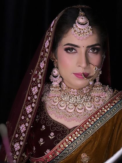 This bride chose not to wear colored lenses, and her natural eye color looks stunning with the pink and brown smokey eye makeup.