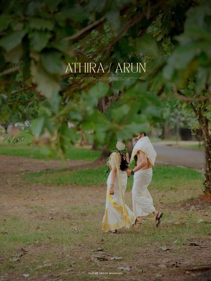 A beautiful shot of Athira and Arun walking together after their temple wedding. The lush green background and soft light create a serene and romantic atmosphere.
