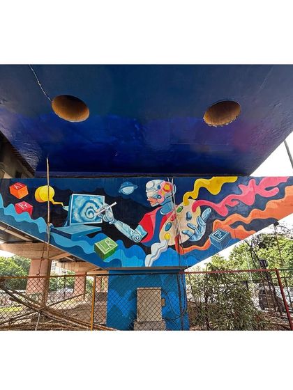 This colorful mural depicts a robot artist creating digital art, symbolizing the intersection of technology and creativity. These public projects are a joy to work on with my team.