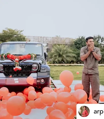 The pure shock and joy of a perfectly executed surprise. We filled the area around the car with balloons to make the reveal even more festive and photogenic.