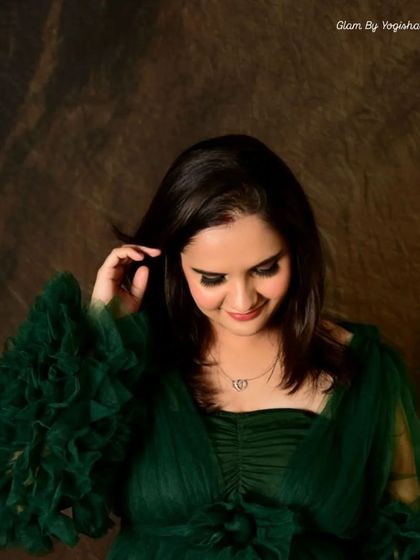 A stunning green smokey eye look. This non-edited photo shows the true color and blend of the makeup, perfect for complementing a green outfit.