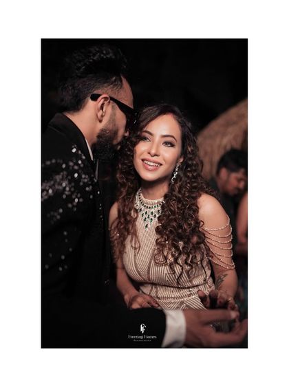 A candid moment of conversation and laughter between the couple at their reception. These are the real, unposed moments that tell your story.