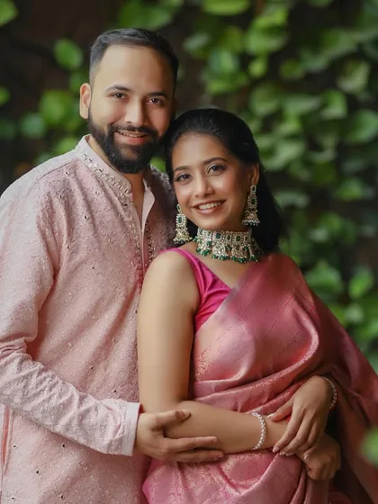 For this engagement, we opted for a classic and elegant look. The bride's beautiful pink silk saree was complemented by clean makeup, a simple bindi, and a traditional hairstyle, creating a look of pure grace.
