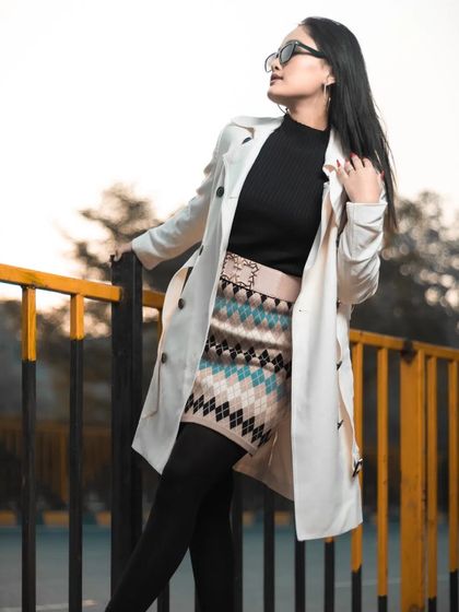 Another shot from the winter fashion series, with the model looking over her shoulder, showcasing the outfit and subtle makeup.