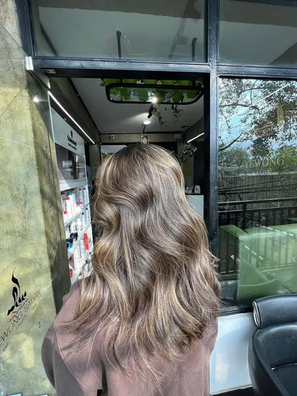 This ash blonde is suitable for various skin tones because of its neutral to cool undertones. It's a color that remains beautiful even as it fades.