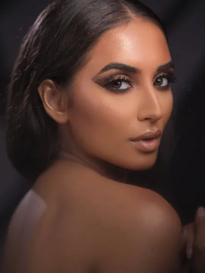 Full glam for a fashion shoot. This look features a bronze smokey eye, sharp contouring, and a nude lip, a classic combination for commercial fashion work.