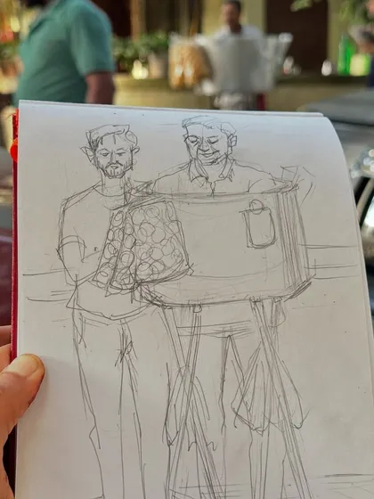 The initial pencil sketch of Sanjay bhaiya, the bhel puri vendor. This shows the first step in my process of capturing a person's likeness and character before adding colour.