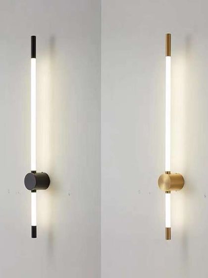 A minimalist linear wall sconce, available in both black and brass finishes. Its sleek design is perfect for modern and industrial spaces.
